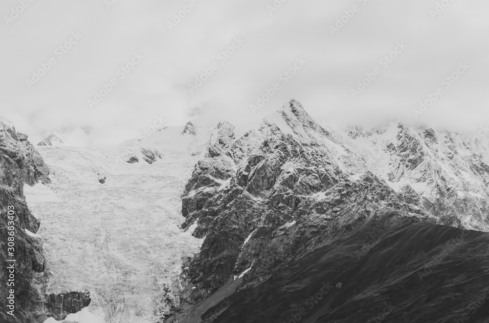 Black and white shot of Mountain landscape. Mount Tetnuldi and glacier Lardaad. Ushguli, Svaneti, Georgia