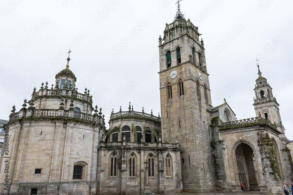 Lugo cathedral church with tower on cloudy day