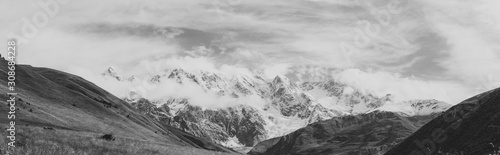 Black and white shot of Panoramic view of Peak Shkhara Zemo Svaneti, Georgia. The main Caucasian ridge