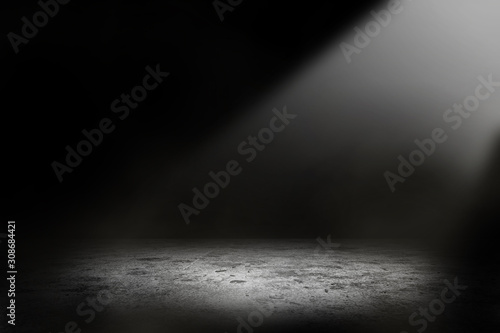 Abstract studio dark room with spot lighting and fog in black background. 
