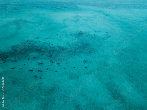 Aerial view of turquoise green sea in Bum Bum Island in Semporna, Sabah, Malaysia.