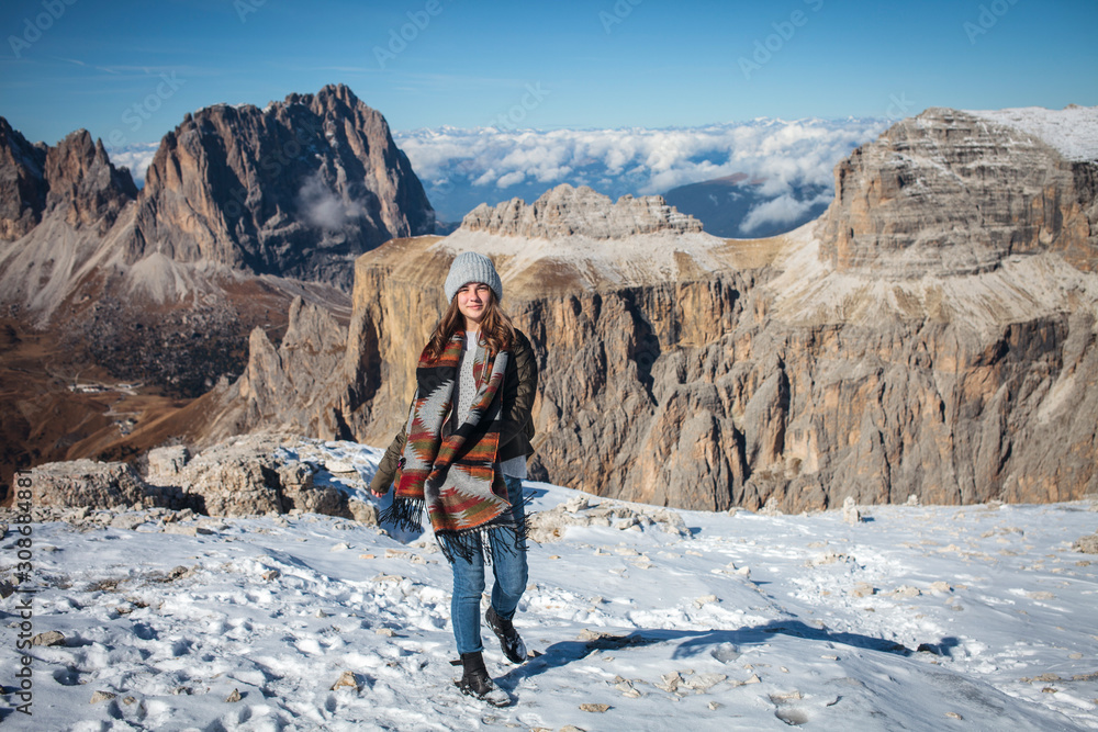 Fototapeta premium Young Beautiful Girl on Top of Alpine Mountains