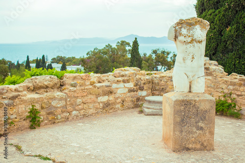 Obraz na plátne Old punic statue of man, ruins of Carthage on Byrsa Hill, near the capital of Tu