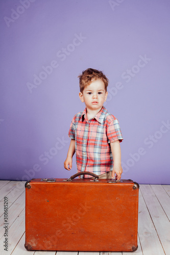 little boy going on a journey with suitcase photo
