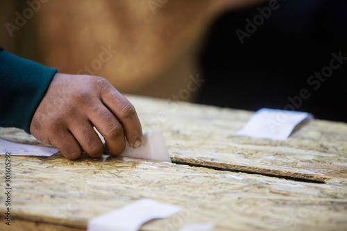 Person voting, casting a ballot