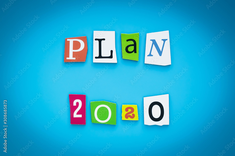Plan-2020. Text on a blue background, multicolor paper letters. Inscription. The planning concept. Single word on banner. Plan-2020. Text on a blue background, multicolor paper letters. Inscription. The planning concept. Single word on banner.