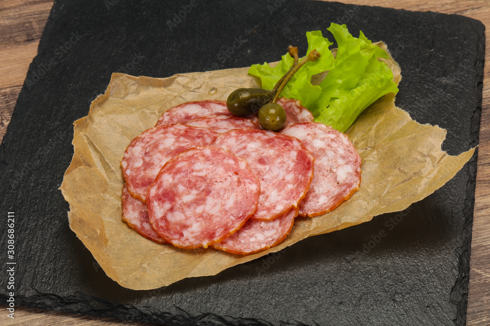Spanish Salchichon sausage with salad Spanish Salchichon sausage with salad
