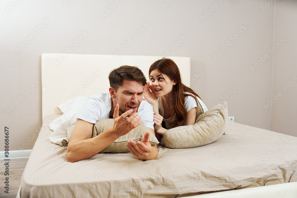couple lying on sofa and watching tv couple lying on sofa and watching tv