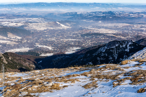View of the popular city of Podhale Zakopane from the Tatra Mountains. Landscape in early winter scenery.