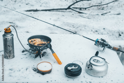 Lunch and cooking while hiking. Gas burner, kettle and other accessories for tourism and fishing.