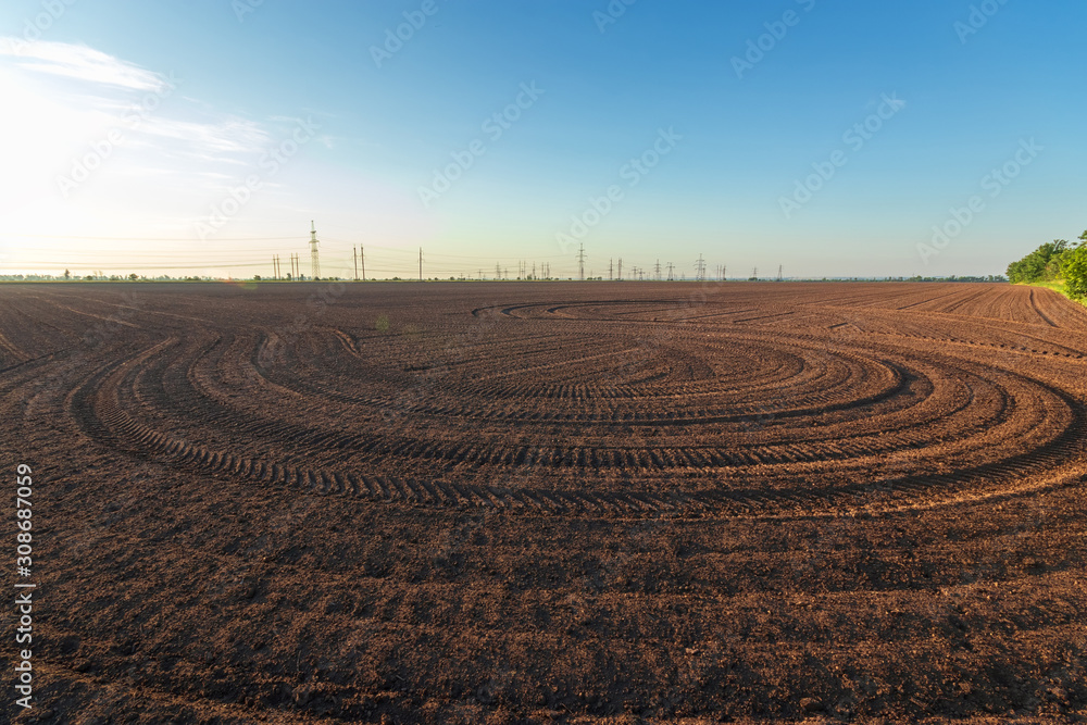 agriculture the land is ploughed to the field / background photo out of the city agriculture