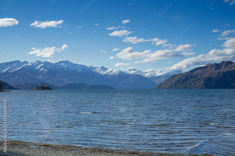 Beautiful Lake Wanaka with snow capped mountain in background.