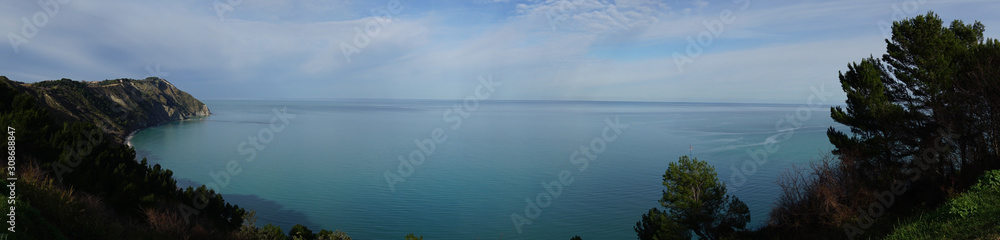 Panoramic view of sea between trees at the summer in Ancona - Portonovo area, Italy, Europe, background
