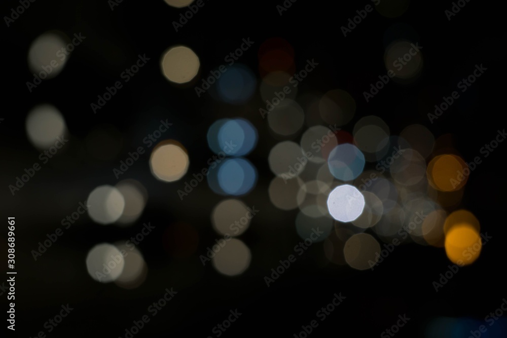 Blue white Bokeh or defocused circle light from city night. Abstract background