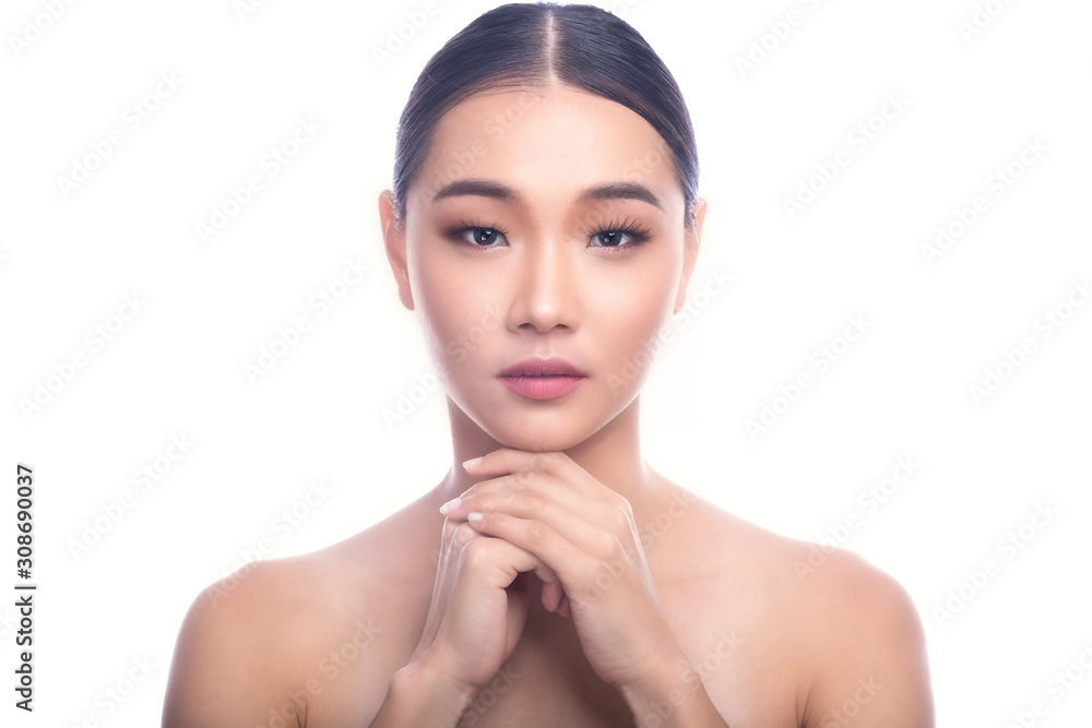 Beautiful Young Asian Woman with Clean Fresh Skin isolate on white background. Spa, Face care, Facial treatment, Beauty and Cosmetics concept. Two hands on chin.