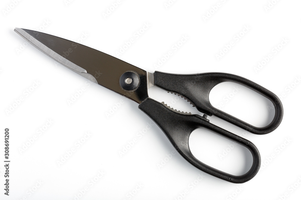 The closed scissors on a white background isolated The closed scissors on a white background isolated