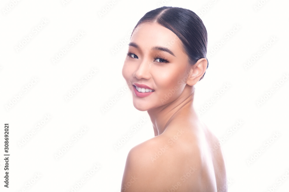 Beautiful Young Asian Woman with Clean Fresh Skin isolate on white background. Spa, Face care, Facial treatment, Beauty and Cosmetics concept. Look from behind, big smile. Beautiful Young Asian Woman with Clean Fresh Skin isolate on white background. Spa, Face care, Facial treatment, Beauty and Cosmetics concept. Look from behind, big smile.