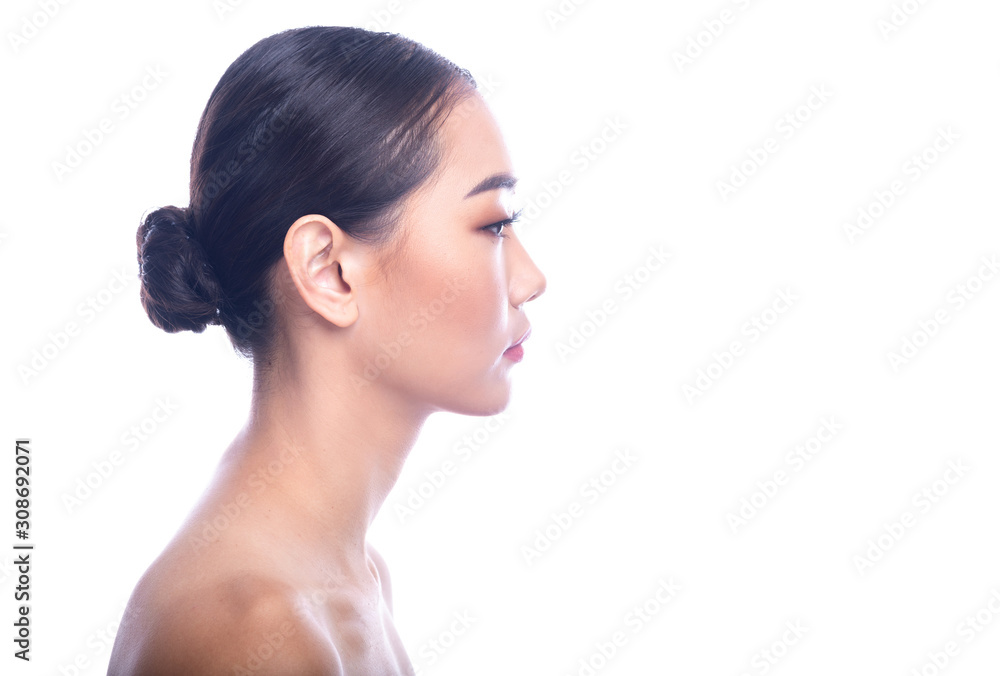 Beautiful Young Asian Woman with Clean Fresh Skin isolate on white background. Spa, Face care, Facial treatment, Beauty and Cosmetics concept. Side shot. Beautiful Young Asian Woman with Clean Fresh Skin isolate on white background. Spa, Face care, Facial treatment, Beauty and Cosmetics concept. Side shot.