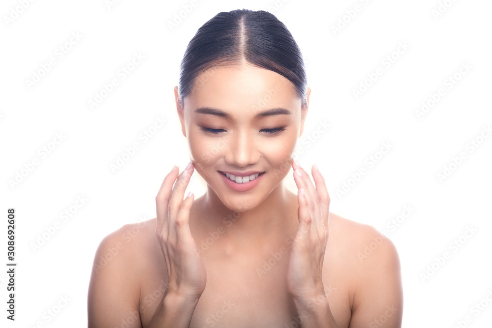 Beautiful Young Asian Woman with Clean Fresh Skin isolate on white background. Spa, Face care, Facial treatment, Beauty and Cosmetics concept. Looking down, big smile. Beautiful Young Asian Woman with Clean Fresh Skin isolate on white background. Spa, Face care, Facial treatment, Beauty and Cosmetics concept. Looking down, big smile.