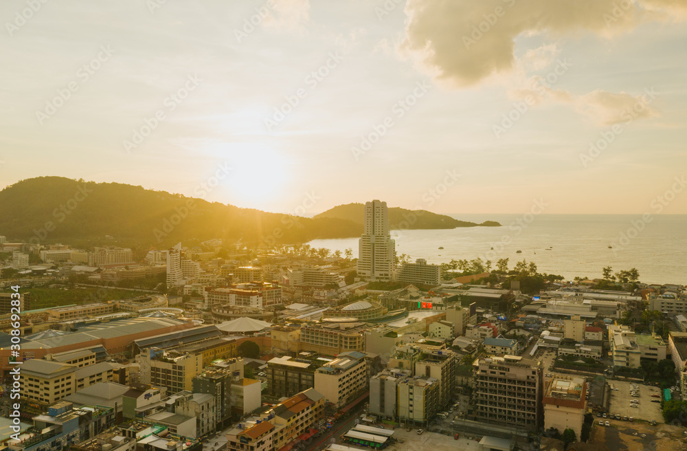 Sunset on Patong Beach and city life in Thailand Phuket Island Drone flight