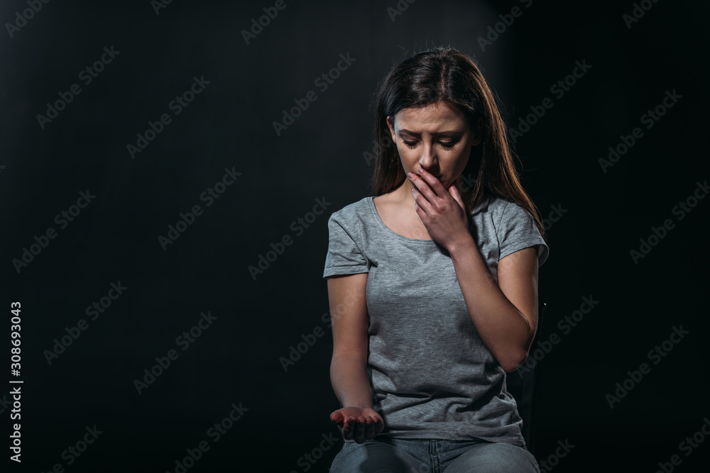despaired woman going to commit suicide by overdosing medicines isolated on black despaired woman going to commit suicide by overdosing medicines isolated on black