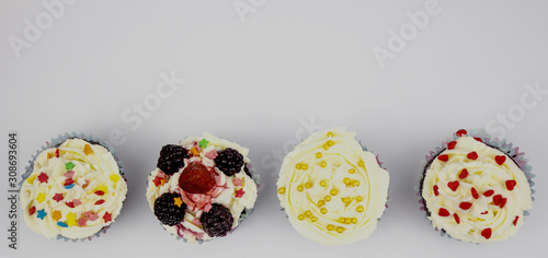 Mafin. Top view on homemade muffins on a white background. A variety of cupcakes. Banner, birthday or holiday. copispace photo