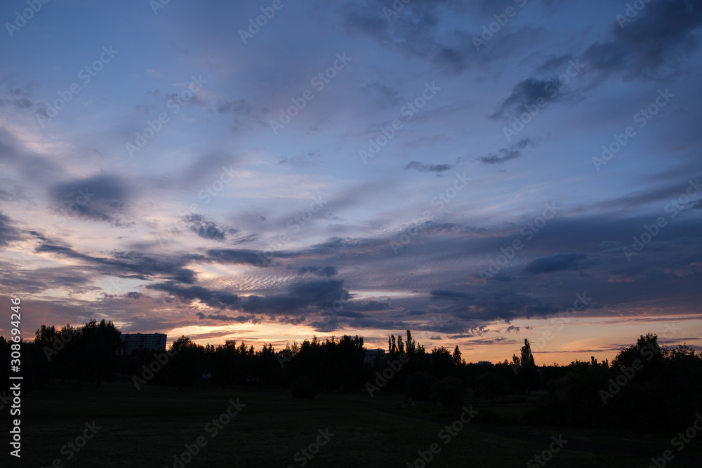 Fototapeta premium Dramatic sunset sky with clouds