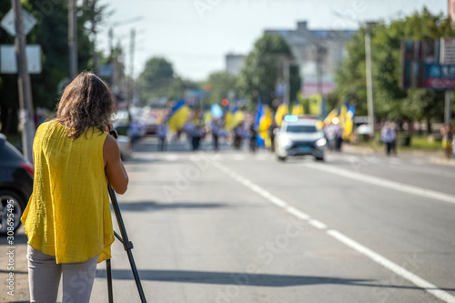 woman operator removes parade © Liubov Kartashova