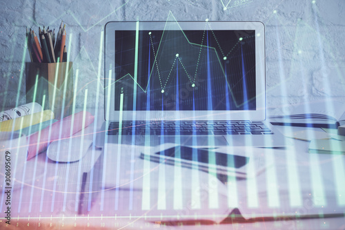 Forex Chart hologram on table with computer background. Double exposure. Concept of financial markets. © peshkova