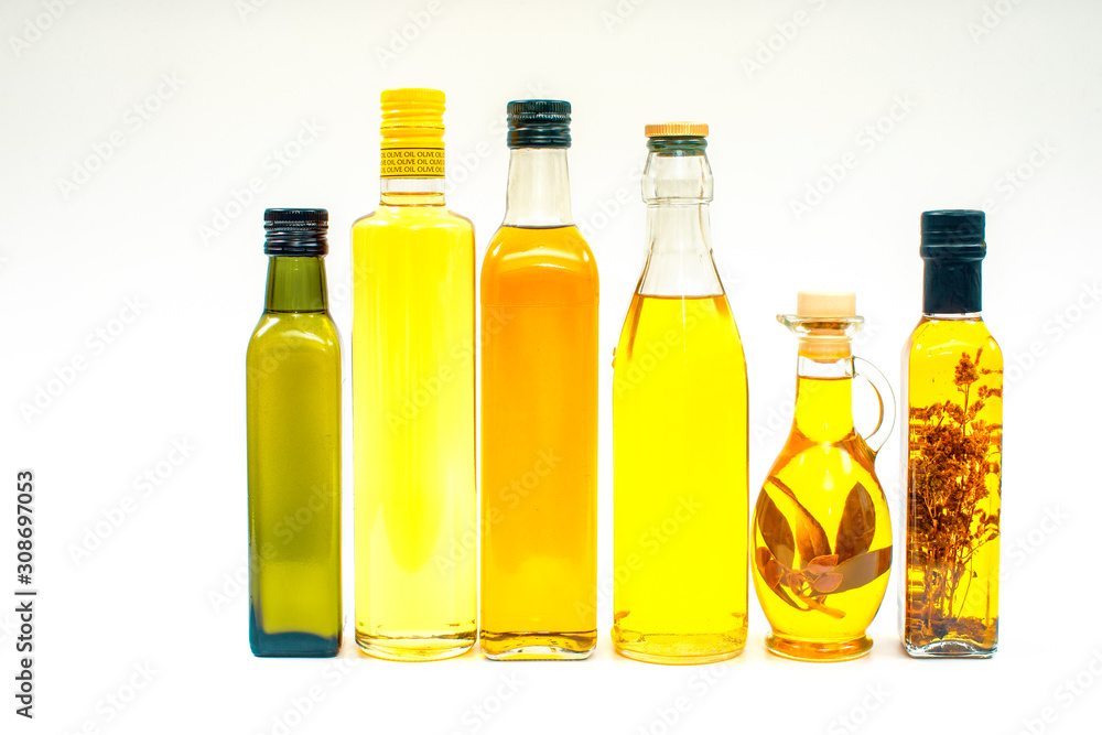 Various bottles with olive oil on a white background Various bottles with olive oil on a white background