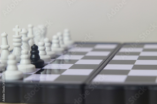 Simple Photo illustration for War  battle or politic situation concept  betrayer beyond the soldier  plastic magnetic small chess  