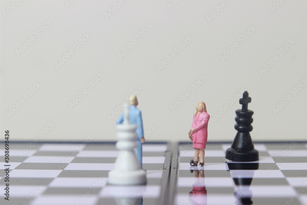Simple illustration for photo War, Battle or politic situation concept, 2 standing mini figure, man and woman negoitation or debate beyond Small Magnetic Plastic chess Simple illustration for photo War, Battle or politic situation concept, 2 standing mini figure, man and woman negoitation or debate beyond Small Magnetic Plastic chess