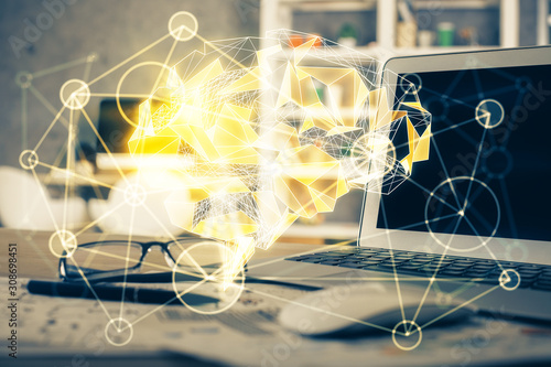 Double exposure of table with computer and brain hologram. Data innovation concept.