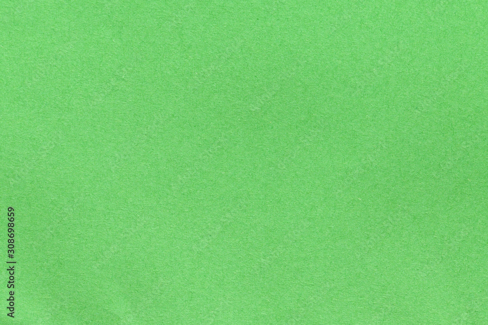 Green blank piece of paper. A high resolution photo of paper ideal as a background or texture. Green blank piece of paper. A high resolution photo of paper ideal as a background or texture.