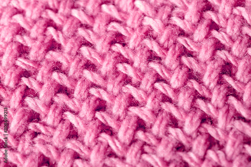 ピンクの模様編みニット編み地のテクスチャ　パターン