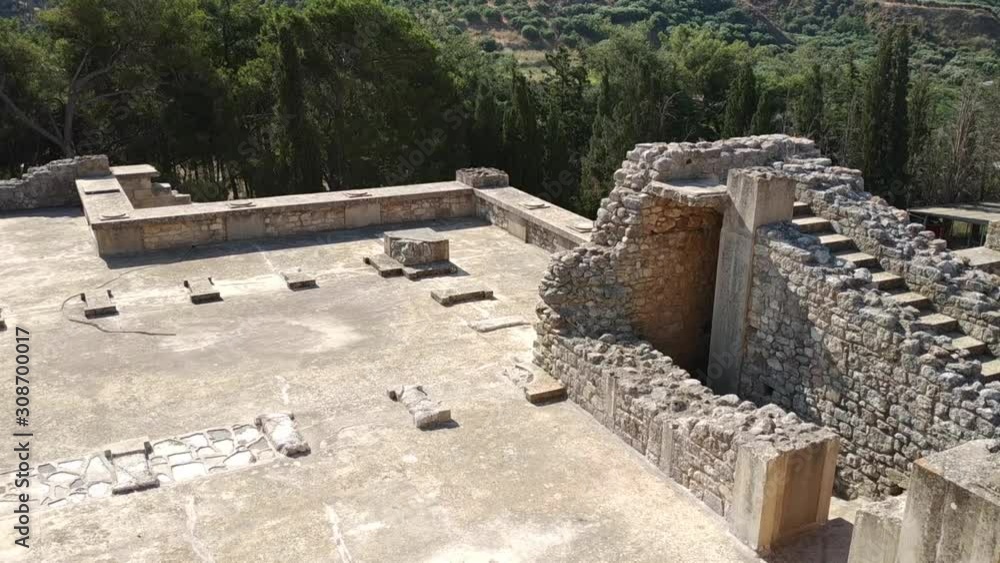 HERAKLION, GREECE - JUNE 05, 2019: casual view on the Knossos temple ruins and visitors HERAKLION, GREECE - JUNE 05, 2019: casual view on the Knossos temple ruins and visitors