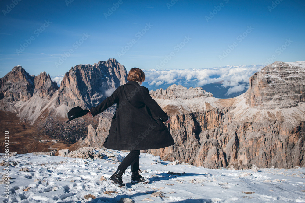 Young Beautiful Girl on Top of Alpine Mountains