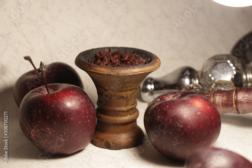 bowl with tobacco for hookah. fruits on a white background. smoking nargile