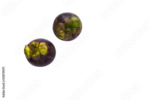 two mangosteen on a white background, isolate. Asian fruits