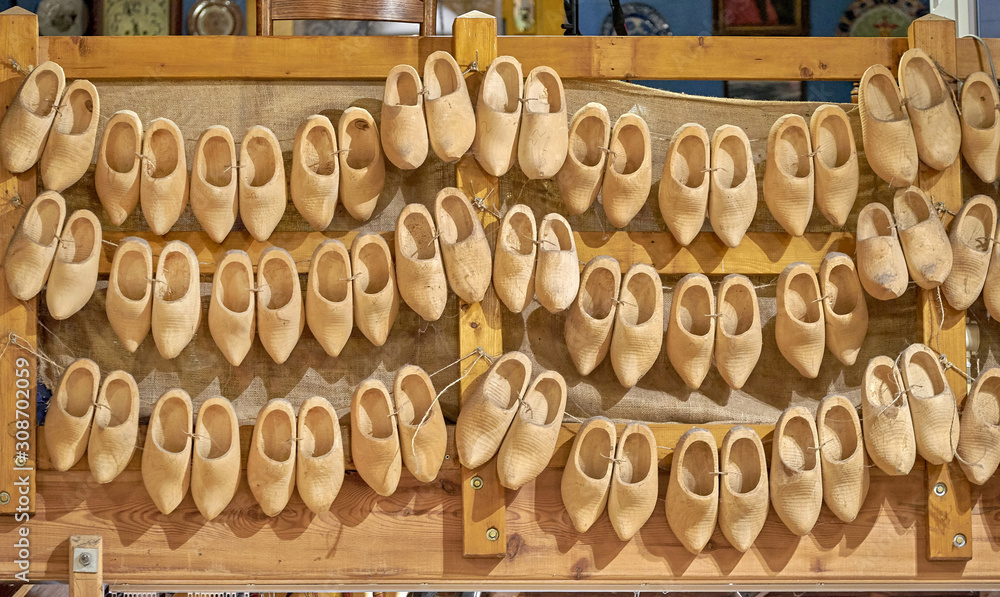 Dutch wooden klomps hanging on the wall of a dutch shop Dutch wooden klomps hanging on the wall of a dutch shop