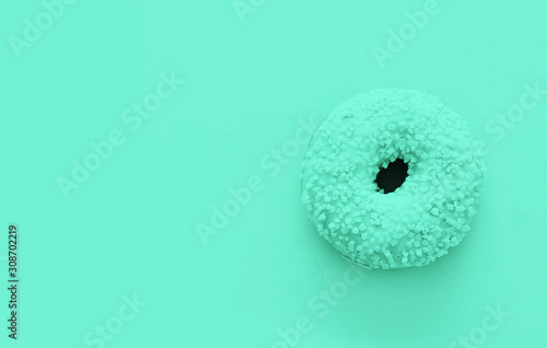 Donut on trendy color background.