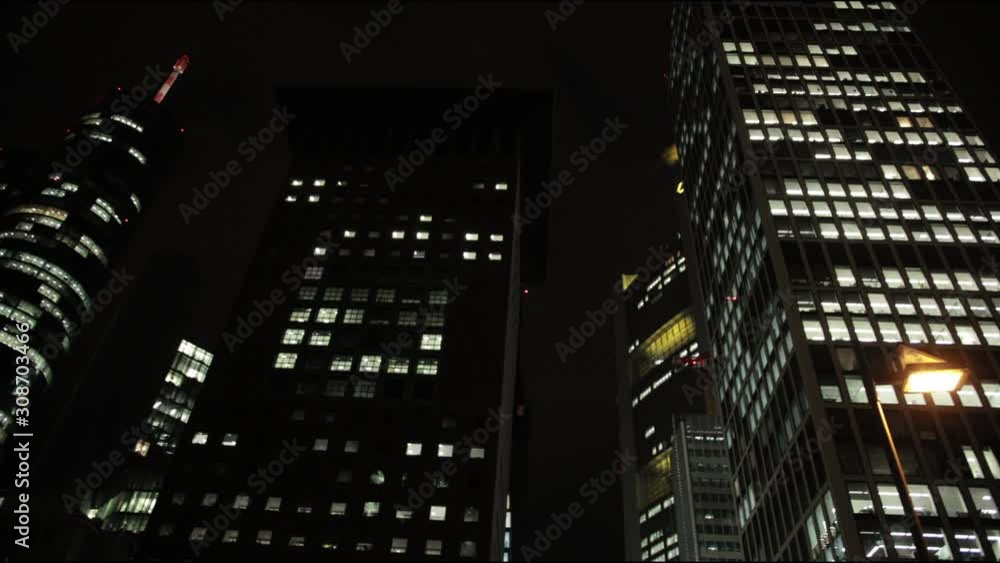 Panorama of night city of metropolis, evening, tall houses, Skyscrapers, light in Windows of offices and apartments of business center. Slow motion Panorama of night city of metropolis, evening, tall houses, Skyscrapers, light in Windows of offices and apartments of business center. Slow motion