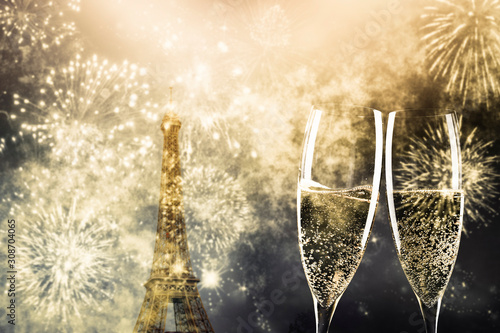 Canvas Print two glasses of champagne and Eiffel tower with fireworks New Year in Paris