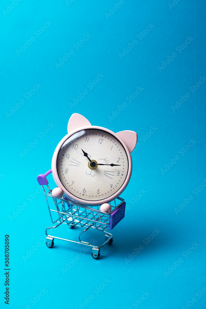 Watch in the shape of a cat in a shopping basket.