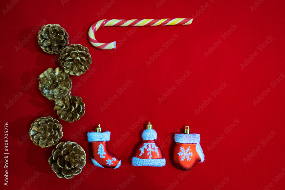 Christmas composition of Santa Claus clothes decoration on red background.