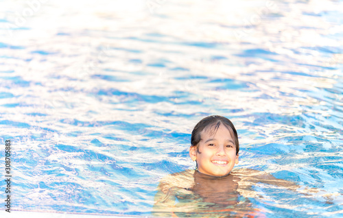 Children enjoying in summer resort at pool