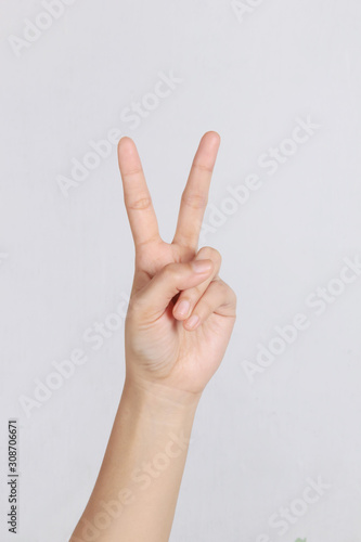 peace symbol using the left hand © Endriyana