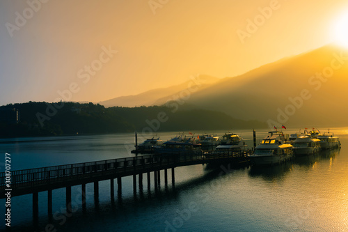  Beautiful landscape of lake level reflect fantasy dramatic sunrise  in Sun Moon Lake , Taiwan. © chanchai