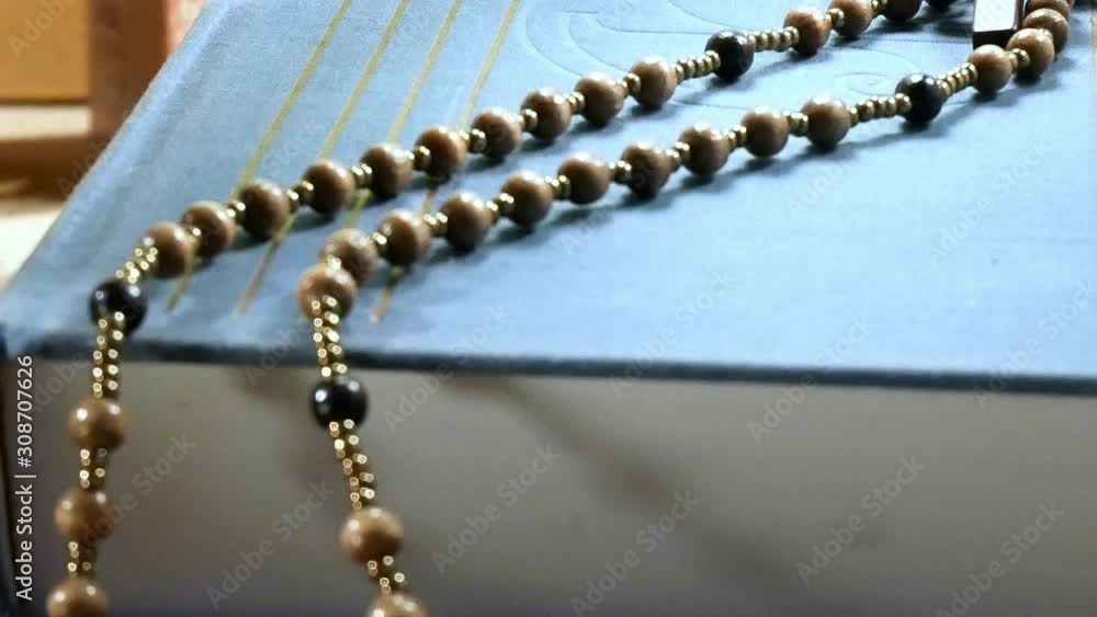 Wooden Rosary on the Bible. Panning Wooden Rosary on the Bible. Panning