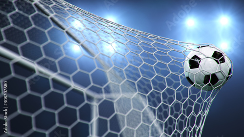 Soccer ball flew into the goal. Soccer ball bends the net, against the background of flashes of light. Soccer ball in goal net on blue background. A moment of delight. 3D illustration photo